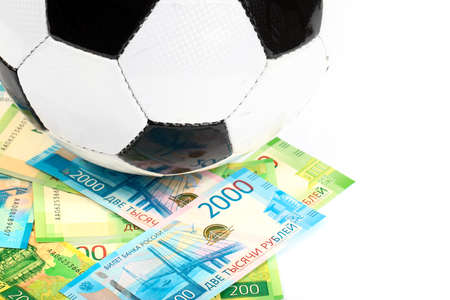 Football ball and paper Russian rubles as the national currency of the championshipの写真素材