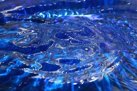 whimsical unique patterns after hitting a drop of water on the surface of the liquidの写真素材