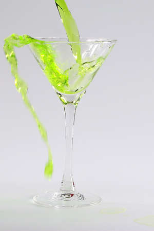 alcoholic drink a cocktail is poured into a glassの写真素材