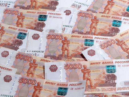 a pile of Russian paper denominations with a nominal value of five thousand rubles