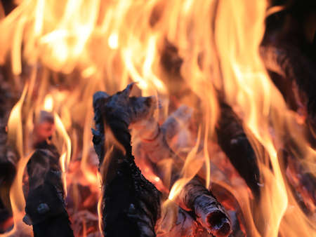 red-hot flames and fire on pieces of coalの写真素材