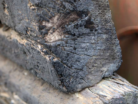 charred wooden beams and logs in place of a rural fireの写真素材