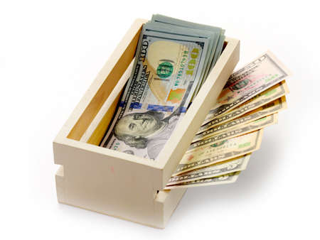 dollars lie in a wooden box