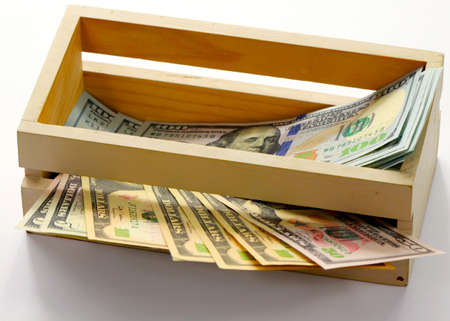 dollars lie in a wooden boxの写真素材