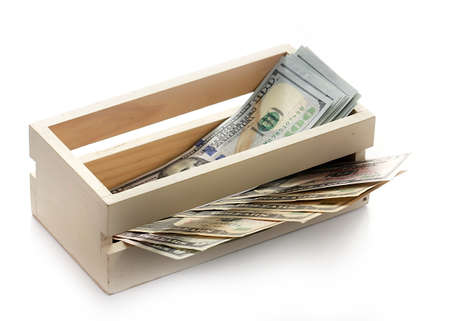 dollars lie in a wooden boxの写真素材
