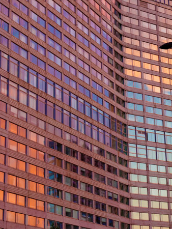 windows of a multi-storey building in the business part of the cityの写真素材