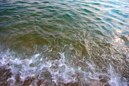 the sandy beach is flooded with clean sea water