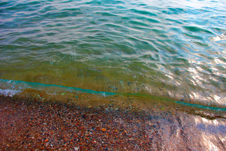 the sandy beach is flooded with clean sea waterの写真素材