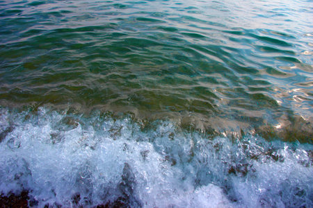 the sandy beach is flooded with clean sea water