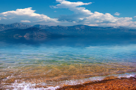 beautiful sandy beach and cloudy sunny sky as a place of entertainmentの写真素材