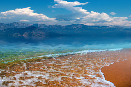 beautiful sandy beach and cloudy sunny sky as a place of entertainmentの写真素材