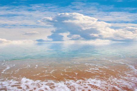 beautiful sandy sea beach and cloudy sunny sky