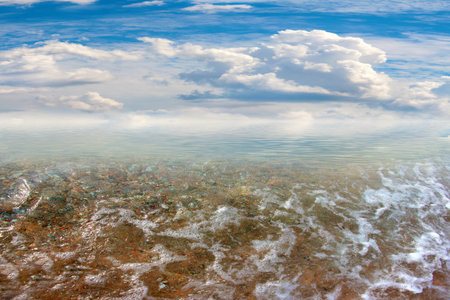 a beautiful sandy sea beach under a sunny skyの写真素材