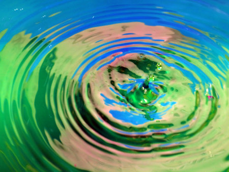 a trace on the surface of the liquid after the impact of a drop of waterの写真素材