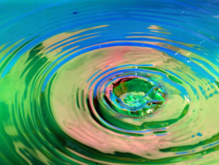 a trace on the surface of the liquid after the impact of a drop of waterの写真素材