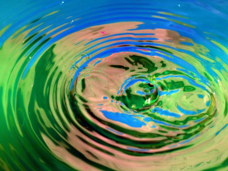 a trace on the surface of the liquid after the impact of a drop of waterの写真素材