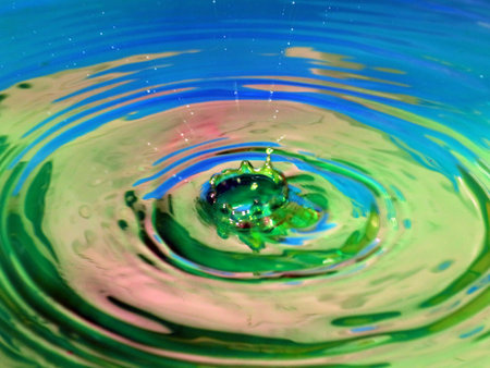 a trace on the surface of the liquid after the impact of a drop of waterの写真素材