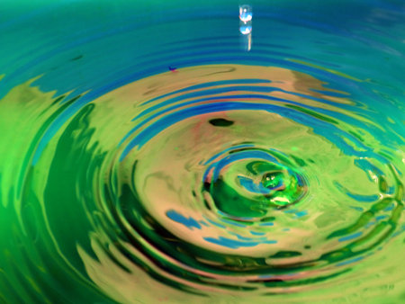 a trace on the surface of the liquid after the impact of a drop of waterの写真素材