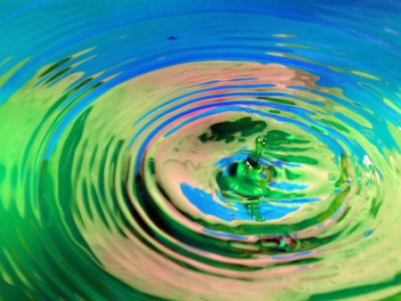 a trace on the surface of the liquid after the impact of a drop of waterの写真素材