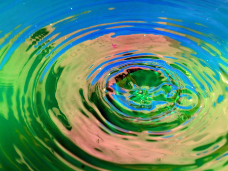 a trace on the surface of the liquid after the impact of a drop of waterの写真素材