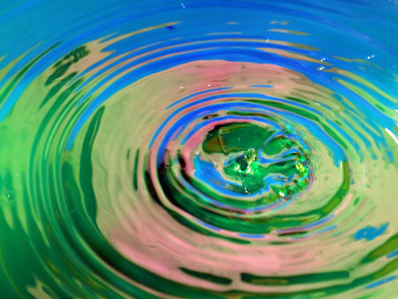 a trace on the surface of the liquid after the impact of a drop of waterの写真素材