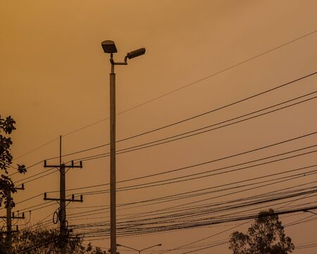 This is a lamppost  on the road in evenning.