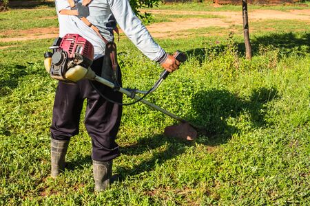 Tha man mowing the Grass.の写真素材
