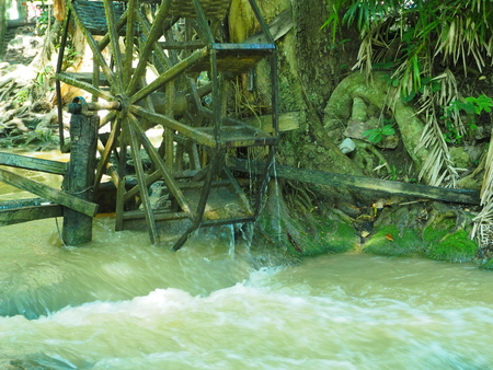 Working watermill wheel in stream.の写真素材
