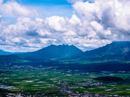 View of extinct volcanoes with village near foothills, Japan.の写真素材