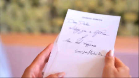 Close-up of female hands holding letter to Santa Claus. Christmas and New Year concept