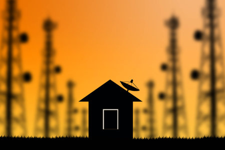 Shadow home with a satellite dish on the roof  sunset background.の写真素材