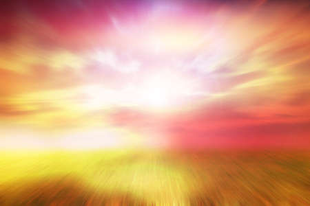 blur green grass and blue skyの写真素材