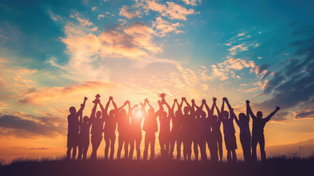 Success of teamwork, joint achievement of goal in business and life. Winning team is holding trophy in hands. Silhouettes of many hands in sunset. --ar 16:9 --v 6 Job ID: cbaa1d46-d19c-4fe1-a945-58ca69250df9の素材