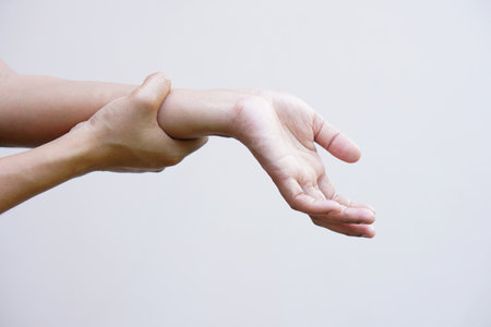 A woman has muscle weakness in the arms and hands.