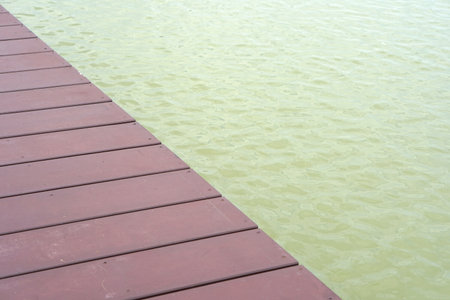 Wooden bridge floor for tourists to walk and enjoy the view in the pool.の写真素材