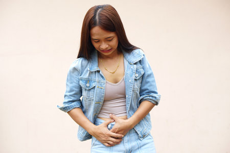 Asian women have abdominal pain from menstruation.の写真素材