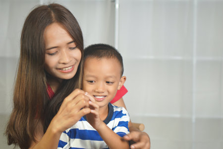 Mother and son playing together happilyの写真素材