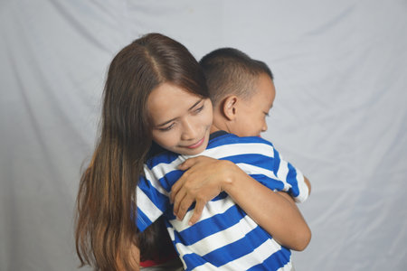 Mother and son playing together happily