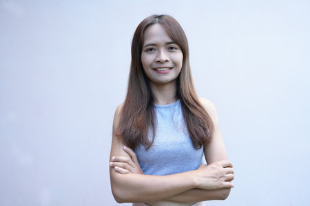 Asian woman smiling happily, white backgroundの写真素材
