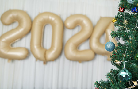 Merry Christmas 2024 concept Christmas balls are used to decorate the Christmas tree at family...