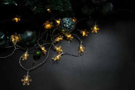 Christmas concept 2024 Christmas tree background. Christmas ball on a black background.