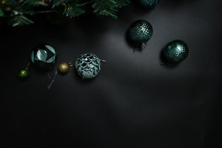 Christmas concept 2024 Christmas tree background. Christmas ball on a black background.の写真素材