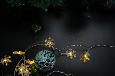 Christmas concept 2024 Christmas tree background. Christmas ball on a black background.