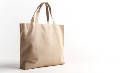 Eco Friendly Beige Colour Fashion Canvas Tote Bag Isolated on White Background. Reusable Bag for Groceries and Shoppingの素材