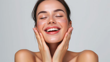 Photo of joyful lady touch hands cheeks complexion enjoy aesthetic ideal perfect skin isolated over grey color backgroundの素材