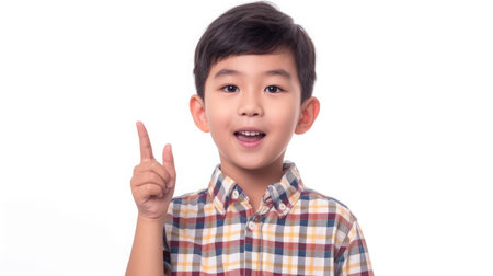 Cute Asian boy having a good idea isolated over a white backgroundの素材