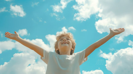 Happy child against blue sky background. Summer vacation conceptの素材
