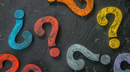 Colorful question marks on chalkboard background. Close up.の素材