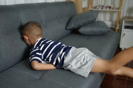 Asian boy has stomach pain from food poisoningの写真素材