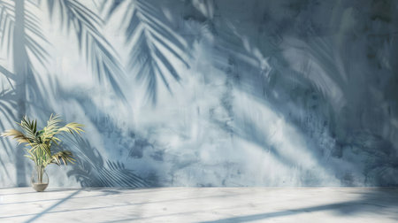 Minimal product placement background with palm shadow on blue plaster wall. Luxury summer architecture interior aesthetic. Boho home room for product platform stage mockupの素材